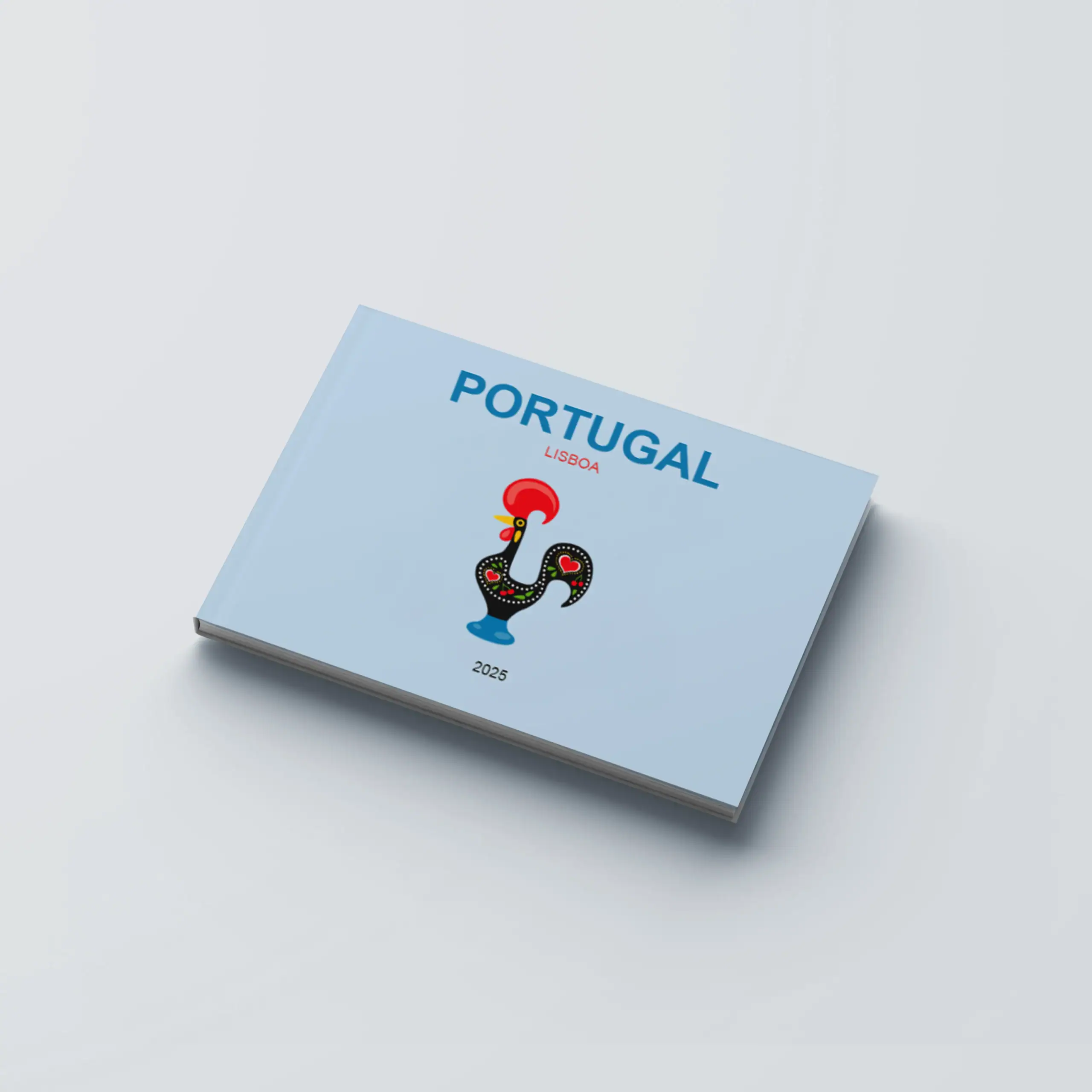 Portugal_CapaDura_H Caderno de capa azul com ilustração de galo português e o texto Portugal Lisboa 2025.
