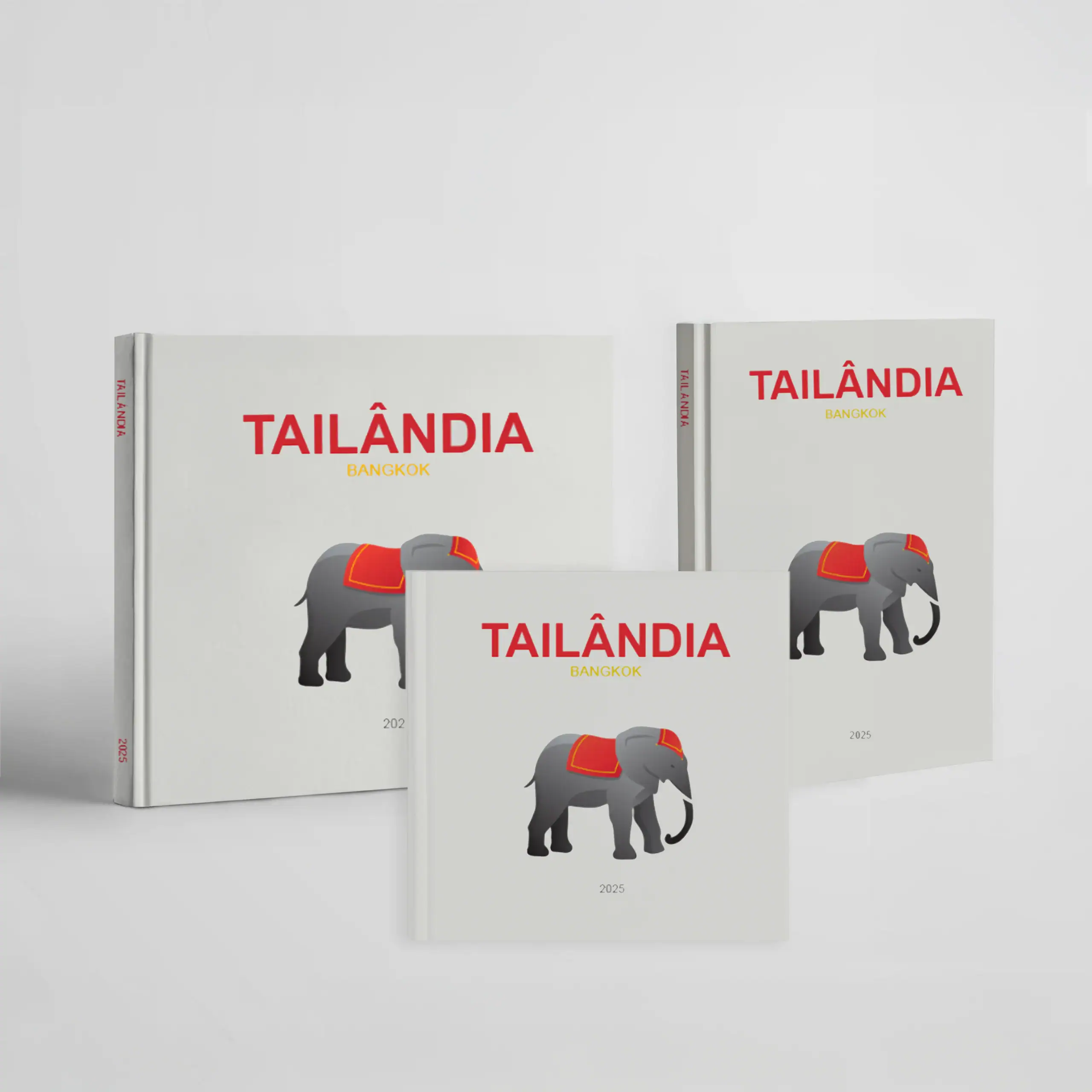 Tailândia_CapaDura Soua de elefante cinzento com capa vermelha e detalhes dourados.